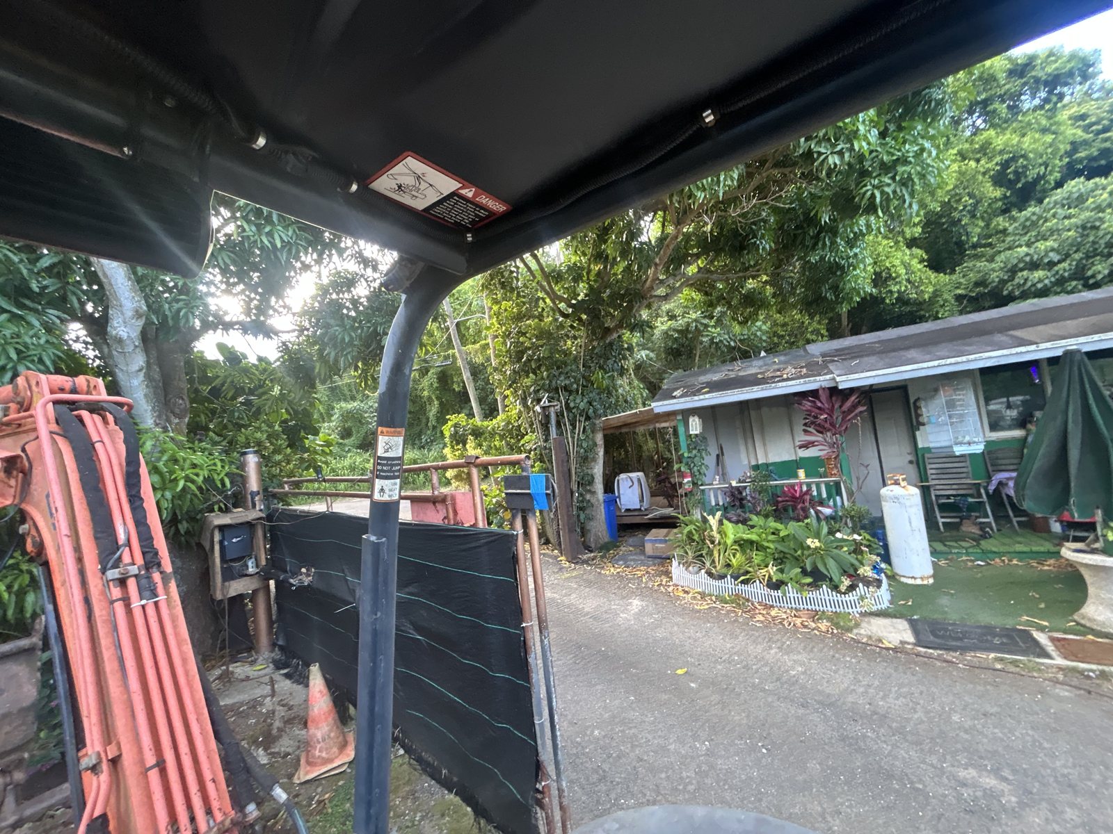 View from the operator area of a machine looking out toward a yard