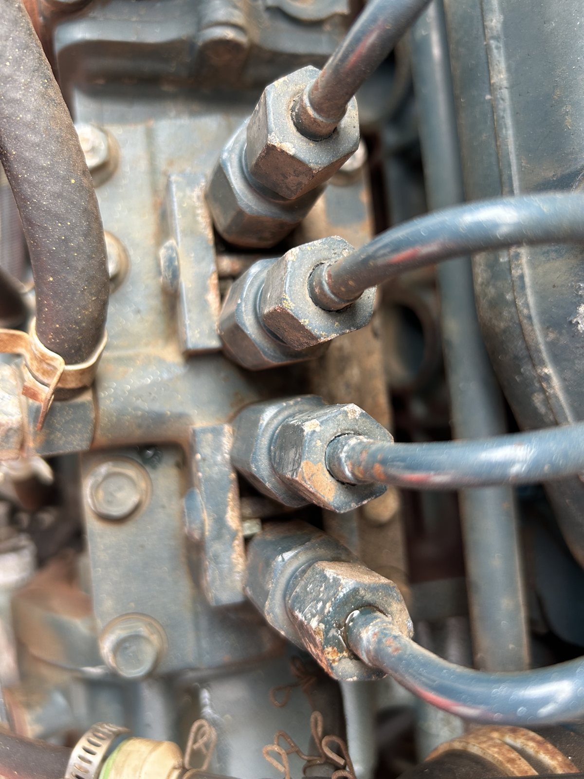 Detail view of hydraulic lines and fittings on machinery